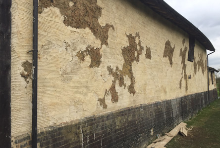Finsihing the outside render of Suffolk barn