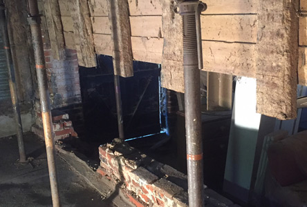 Litfing the stucture to help repair of wooden boards